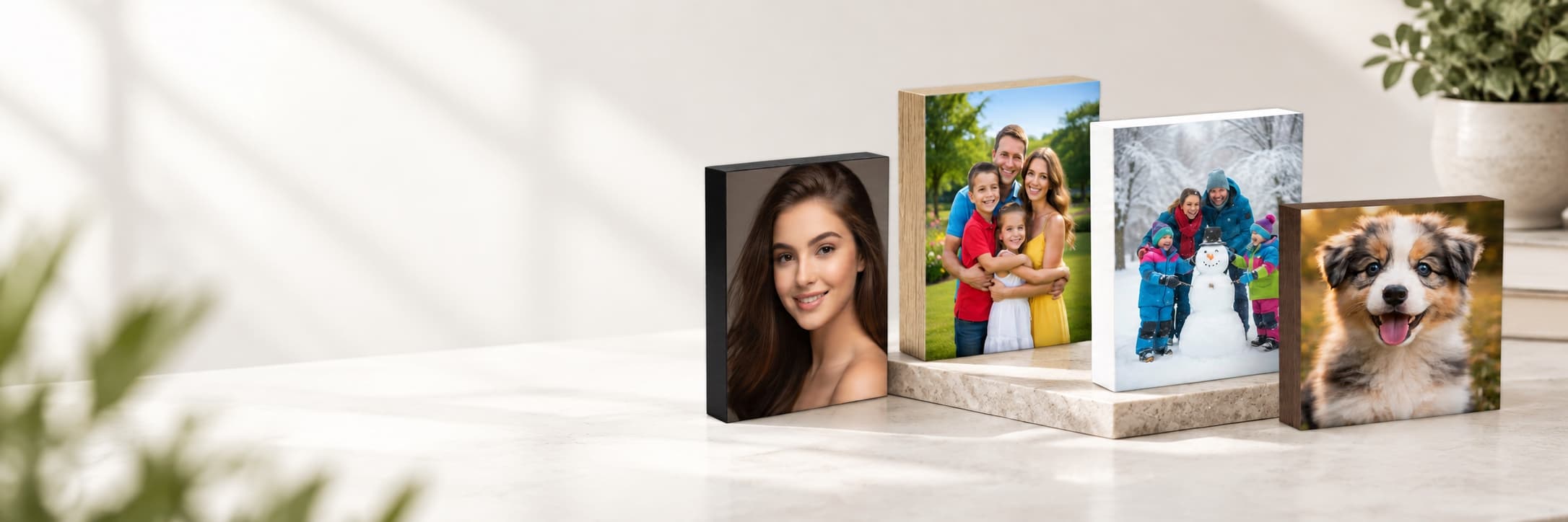 Four photo blocs with black, oak, white and walnut edges, printed with a portrait, two family photos and a puppy